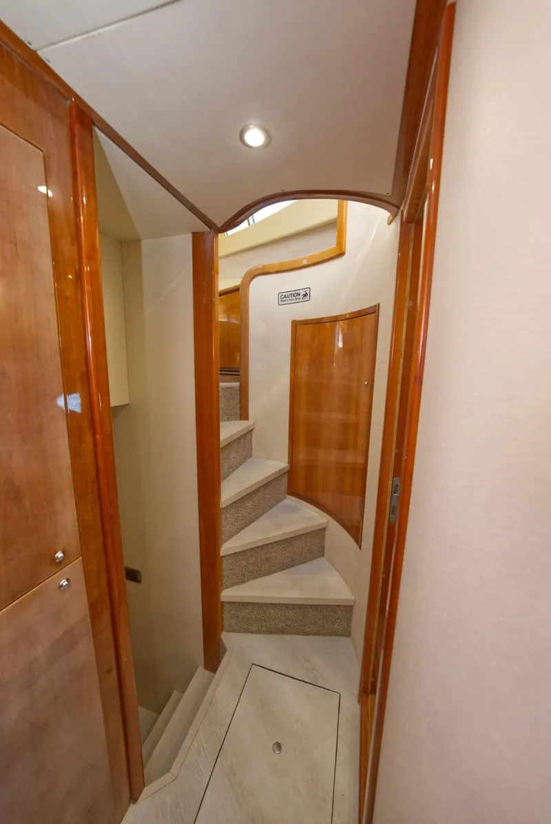 Slide: The Image of Interior of 2003 Aicon 56 yacht with wooden stairs and elegant design. - 29