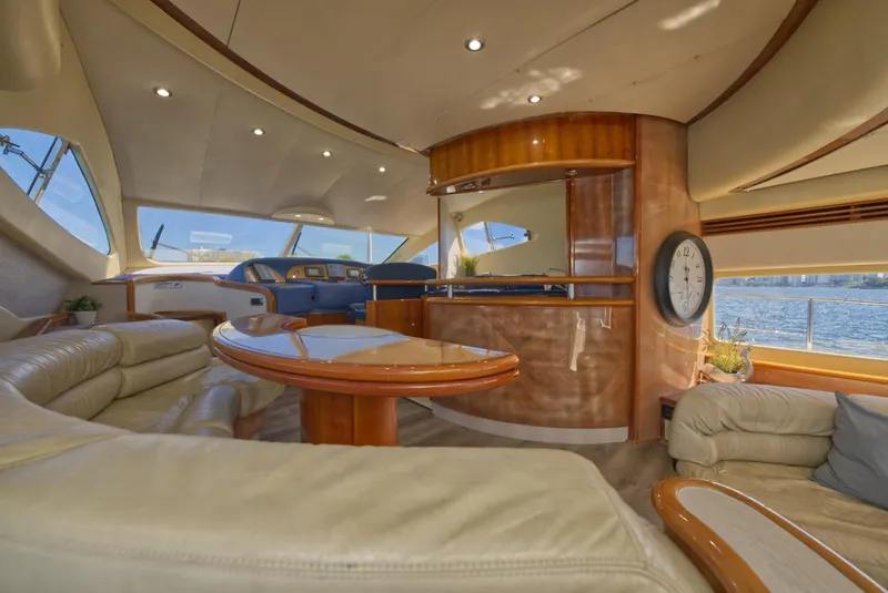 Slide: The Image of Luxurious interior of 2003 Aicon 56 yacht with elegant wood finishes and plush seating. - 30