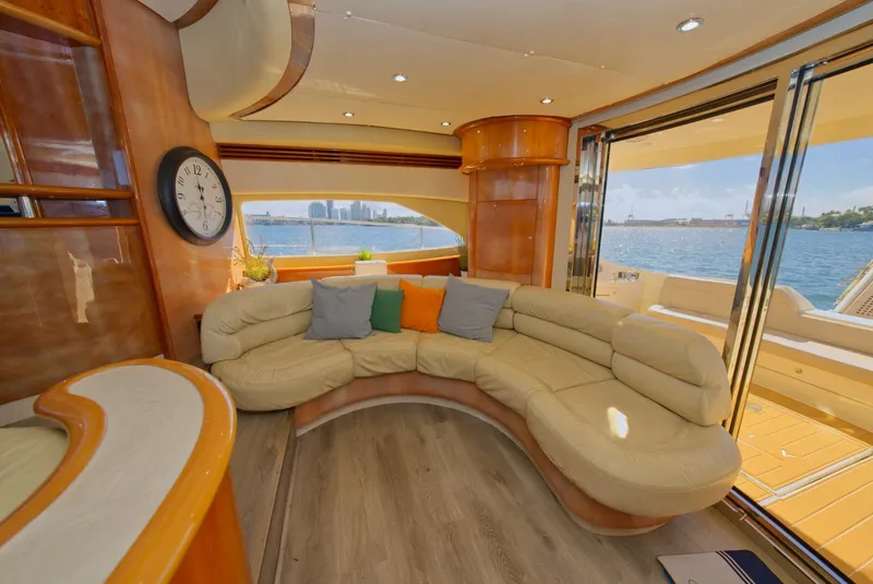 Slide: The Image of Luxurious 2003 Aicon 56 yacht interior with curved seating and waterfront view. - 31