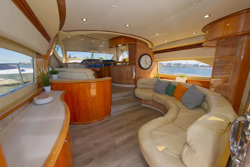 Slide: The Image of Luxurious 2003 Aicon 56 yacht interior with plush seating and elegant wood finishes. - 32