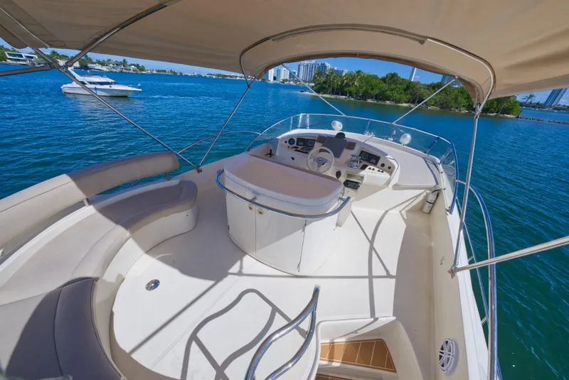 Slide: The Image of Luxurious 2003 Aicon 56 yacht with spacious deck and scenic waterfront view. - 35