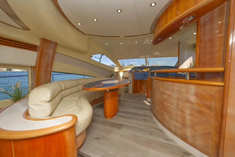 Slide: The Image of Luxurious interior of 2003 Aicon 56 yacht with elegant wood finishes and plush seating. - 41