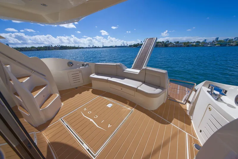 Slide: The Image of Luxurious 2003 Aicon 56 yacht deck with seating, overlooking serene blue waters. - 42