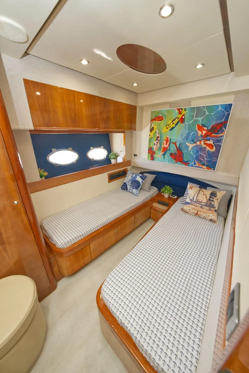 Slide: The Image of Luxurious cabin interior of 2003 Aicon 56 yacht with twin beds and vibrant artwork. - 48