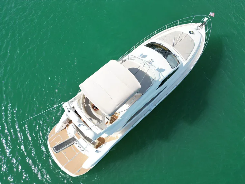 Slide: The Image of Aerial view of 2003 Aicon 56 yacht on turquoise water. - 6