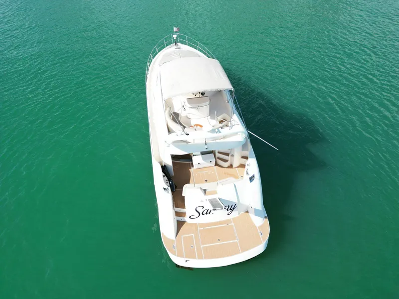 Slide: The Image of Aerial view of 2003 Aicon 56 yacht on turquoise water. - 7
