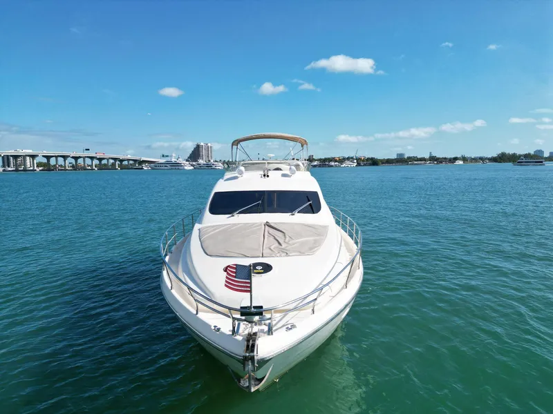 Slide: The Image of Aicon 56 yacht from 2003 on clear blue water under a sunny sky. - 8