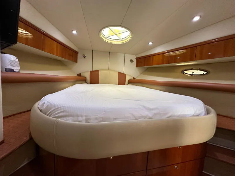 Slide: The Image of Luxurious cabin interior of 2001 Sunseeker 44 Camargue yacht with cozy bed. - 11