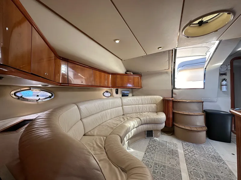 Slide: The Image of Luxurious interior of 2001 Sunseeker 44 Camargue yacht with leather seating and wooden accents. - 15