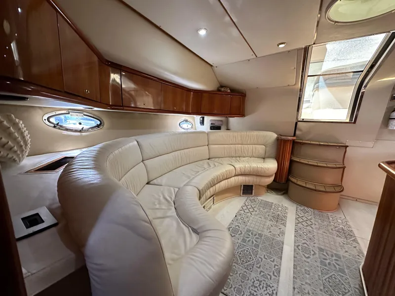 Slide: The Image of Luxurious interior of 2001 Sunseeker 44 Camargue yacht with curved leather seating. - 22