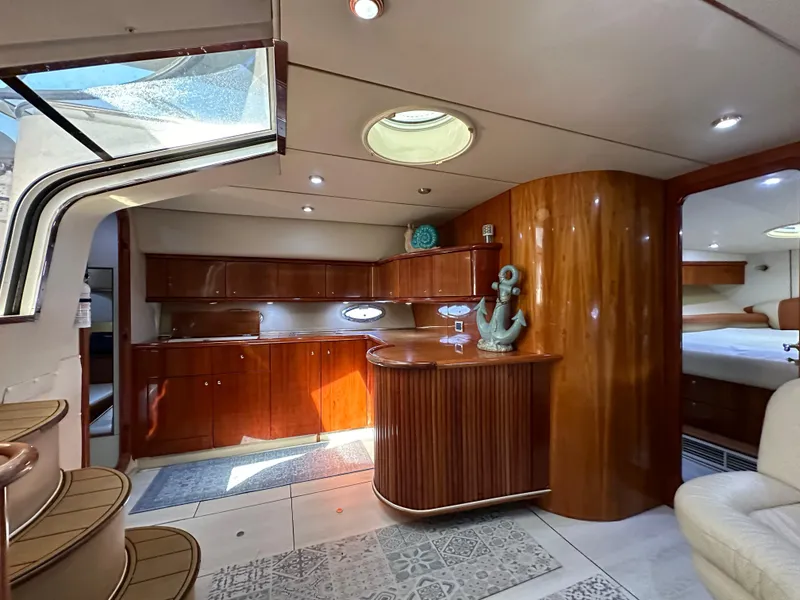 Slide: The Image of Luxurious interior of 2001 Sunseeker 44 Camargue yacht with elegant wood finishes. - 23