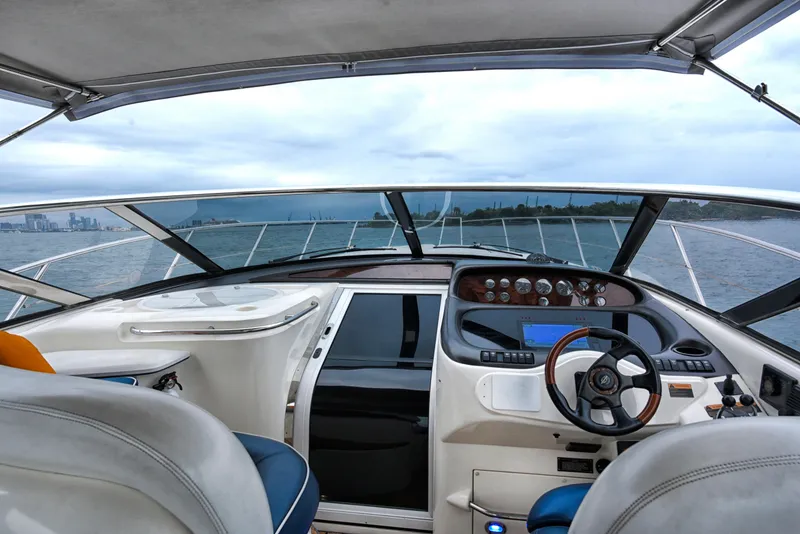 Slide: The Image of Interior view of 2001 Sunseeker 44 Camargue yacht cockpit, featuring steering wheel and dashboard. - 3