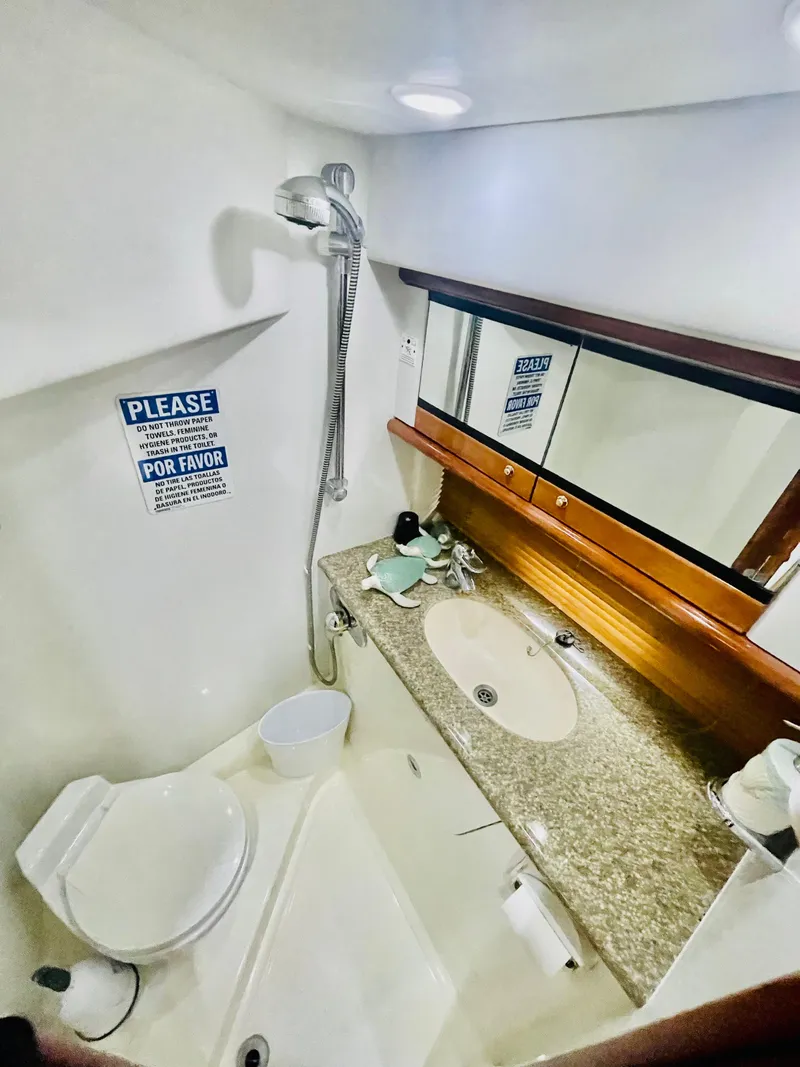 Slide: The Image of 2001 Sunseeker 44 Camargue bathroom with shower, sink, and mirror. - 7