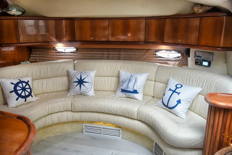 Slide: The Image of Luxurious 2001 Sunseeker 44 Camargue yacht interior with nautical-themed cushions. - 8