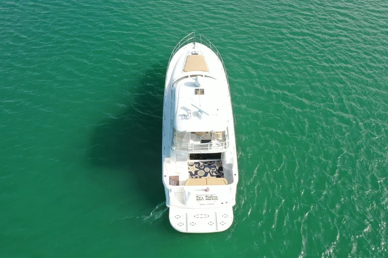 Slide: The Image of Aerial view of 2001 Sea Ray 480 Sedan Bridge yacht on turquoise water. - 21