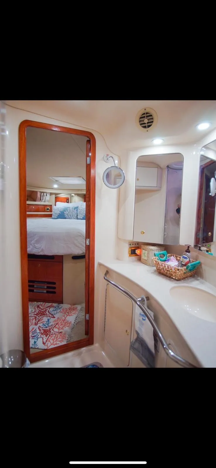 Slide: The Image of 2001 Sea Ray 480 Sedan Bridge bathroom interior with mirror and sink. - 30