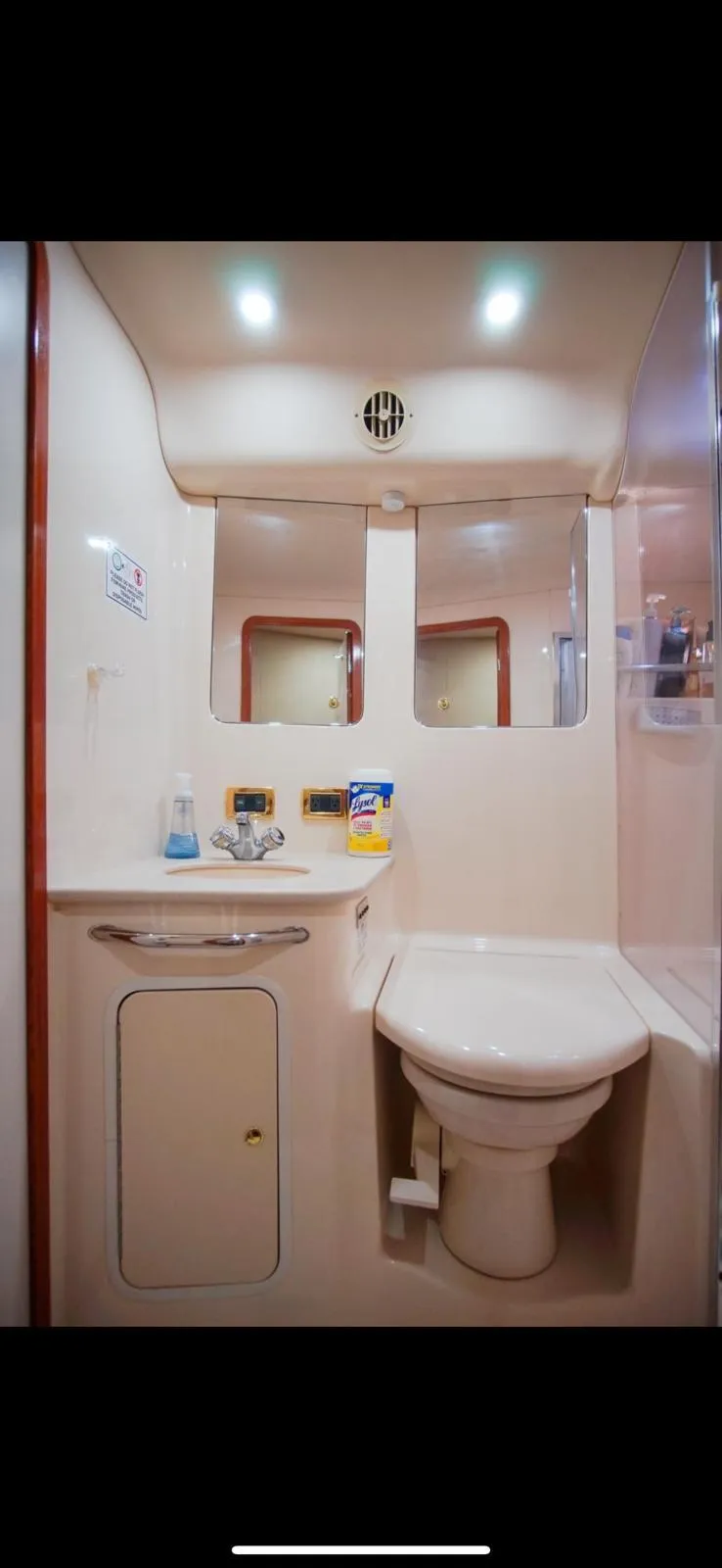 Slide: The Image of 2001 Sea Ray 480 Sedan Bridge bathroom interior with sink and toilet. - 31