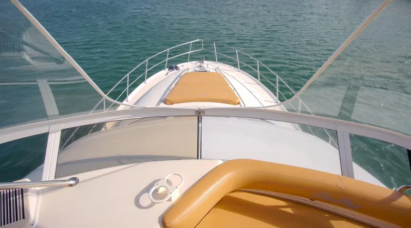 Slide: The Image of 2001 Sea Ray 480 Sedan Bridge yacht on calm water, view from helm. - 39