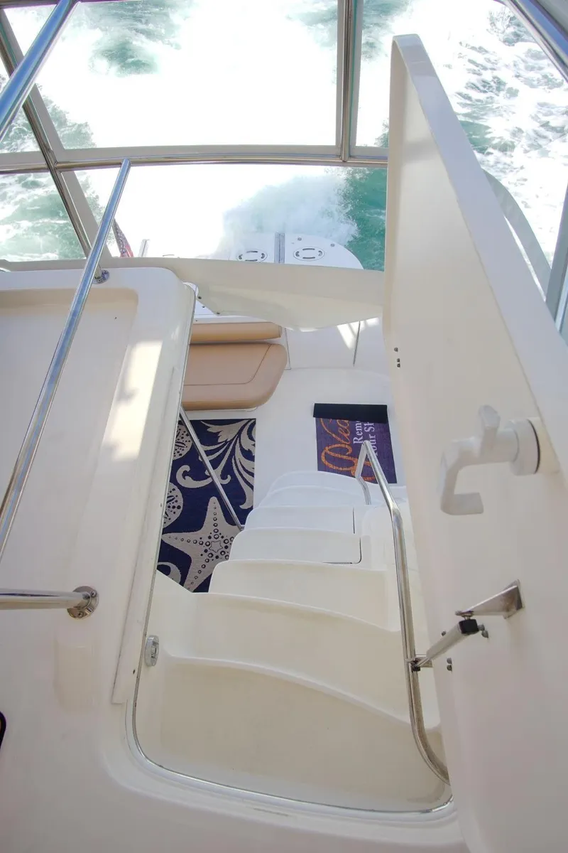 Slide: The Image of Staircase on 2001 Sea Ray 480 Sedan Bridge yacht with ocean view. - 40