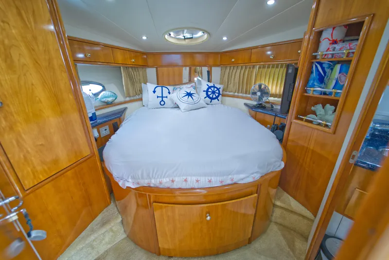 Slide: The Image of Luxurious cabin interior of 2002 Carver 410 Sport Sedan with nautical-themed decor. - 13