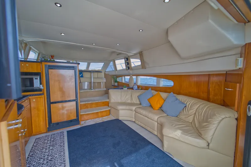 Slide: The Image of Luxurious interior of a 2002 Carver 410 Sport Sedan with plush seating and modern amenities. - 7