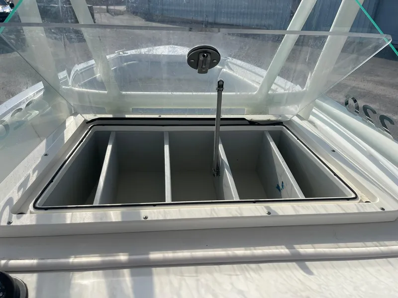 Slide: The Image of Open storage compartment on 2016 Sailfish 220 CC boat. - 11