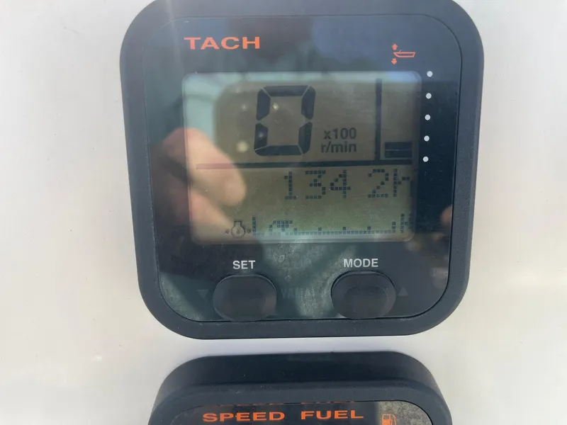 Slide: The Image of Close-up of a 2016 Sailfish 220 CC tachometer displaying 1342 hours. - 12