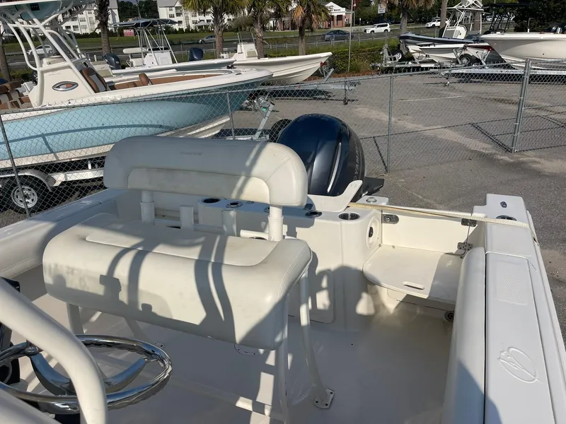 Slide: The Image of 2016 Sailfish 220 CC boat interior with seating and steering wheel. - 8