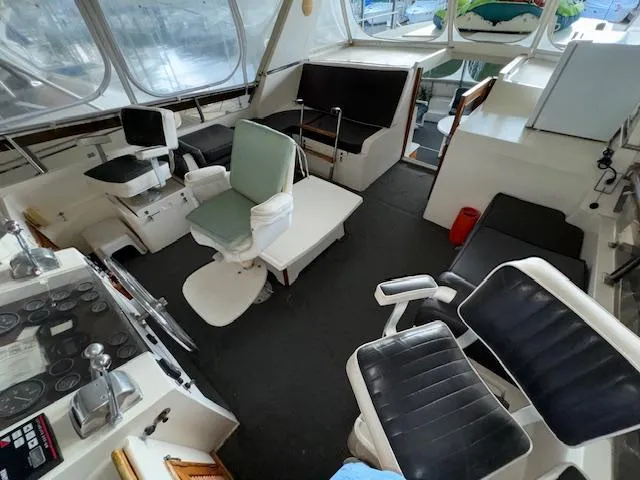 Slide: The Image of 1987 Seamaster 48 Motor Yacht interior with seating and control panel. - 14