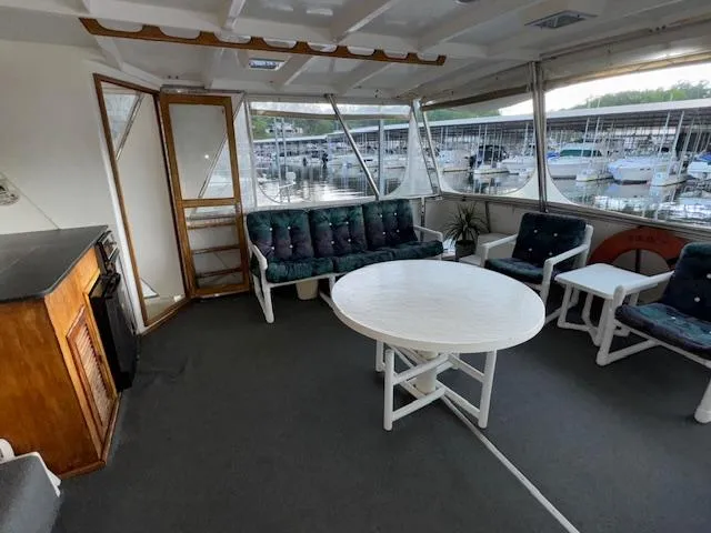 Slide: The Image of Interior of 1987 Seamaster 48 Motor Yacht with seating and round table. - 21
