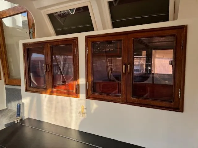 Slide: The Image of Interior of 1987 Seamaster 48 Motor Yacht with wooden cabinets and windows. - 23