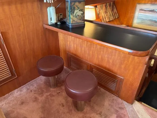Slide: The Image of Interior of 1987 Seamaster 48 Motor Yacht with bar and stools. - 27