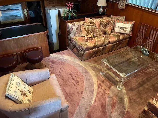 Slide: The Image of Interior of 1987 Seamaster 48 Motor Yacht with plush seating and glass table. - 28