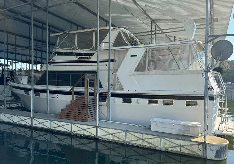 Slide: The Image of 1987 Seamaster 48 Motor Yacht docked in a covered marina. - 3