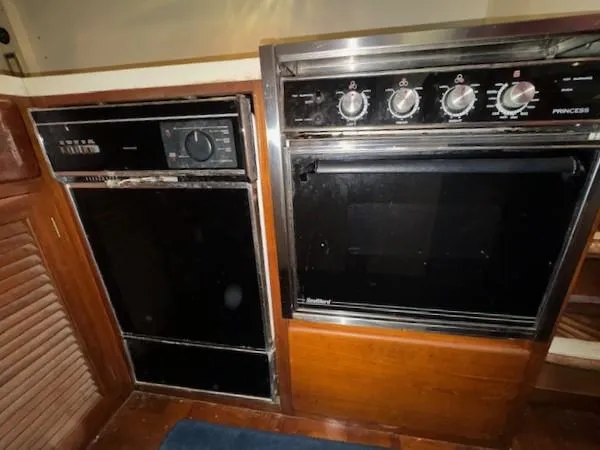 Slide: The Image of 1987 Seamaster 48 Motor Yacht kitchen appliances, featuring a stove and oven. - 37