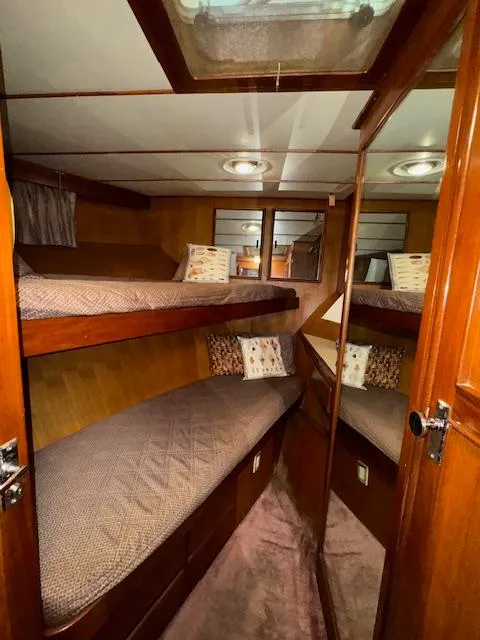 Slide: The Image of Cozy cabin interior of 1987 Seamaster 48 Motor Yacht with wooden finishes and bunk beds. - 39