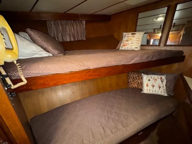 Slide: The Image of Interior cabin of 1987 Seamaster 48 Motor Yacht with bunk beds and pillows. - 41