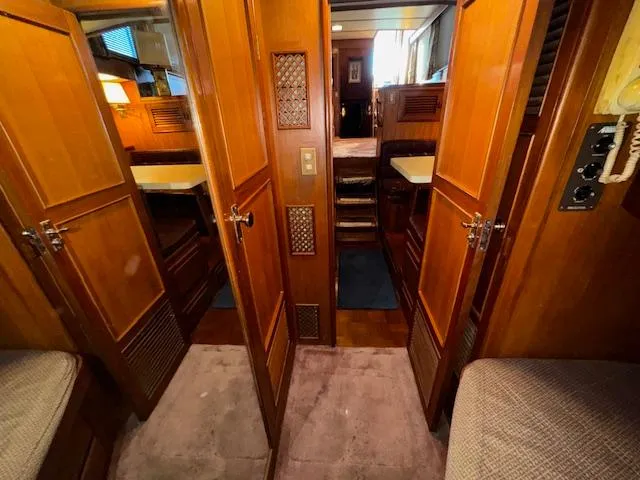 Slide: The Image of Interior of 1987 Seamaster 48 Motor Yacht with wooden cabinetry and cozy furnishings. - 42