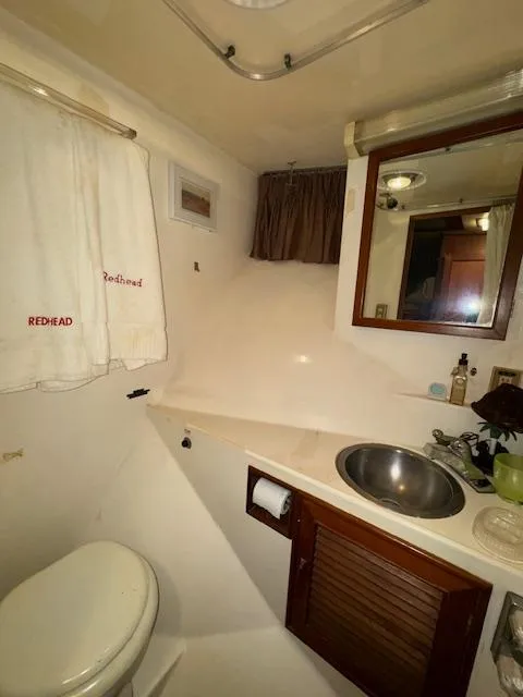 Slide: The Image of Bathroom interior of 1987 Seamaster 48 Motor Yacht with sink and mirror. - 43