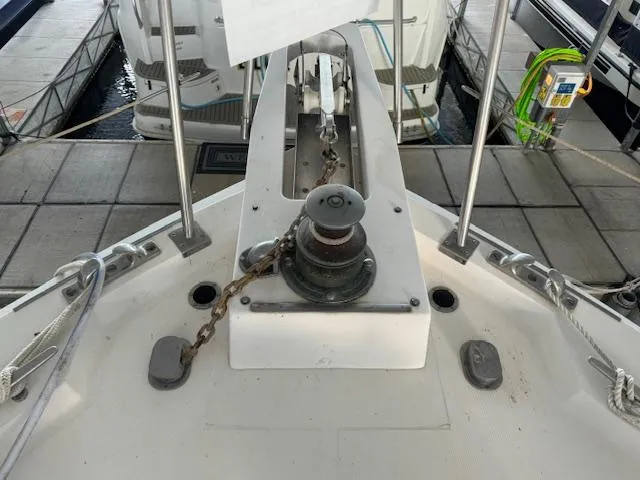 Slide: The Image of 1987 Seamaster 48 Motor Yacht anchor winch and chain on deck at marina. - 8