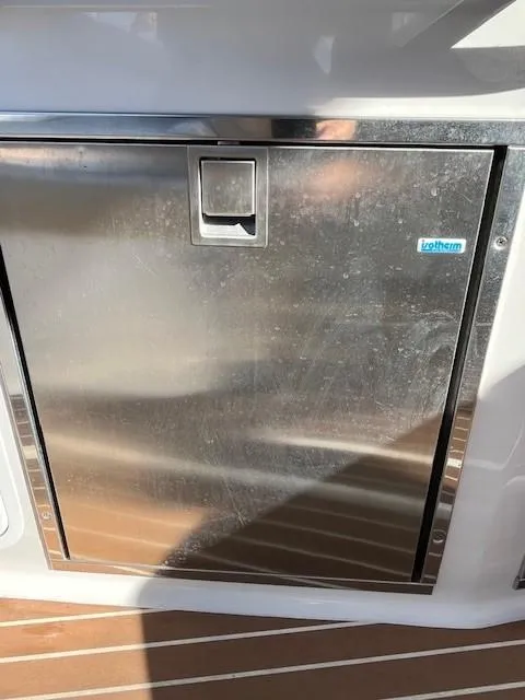 Slide: The Image of Stainless steel compartment door on 2009 Four Winns V435 boat. - 19