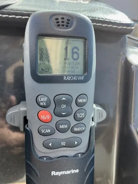 Slide: The Image of Raymarine VHF radio on 2009 Four Winns V435 boat dashboard. - 27