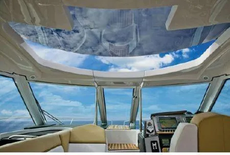 Slide: The Image of Interior view of 2009 Four Winns V435 yacht with panoramic windows and modern dashboard. - 3