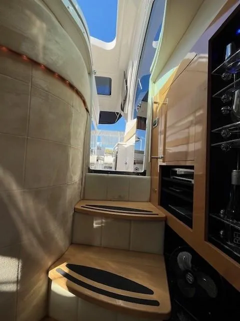 Slide: The Image of Interior view of 2009 Four Winns V435 yacht with wooden steps and modern design. - 35