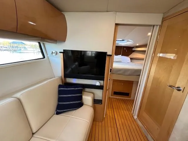 Slide: The Image of Interior of 2009 Four Winns V435 yacht with cozy seating and modern amenities. - 42