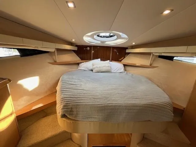 Slide: The Image of Luxurious 2009 Four Winns V435 yacht bedroom with cozy bed and modern lighting. - 44