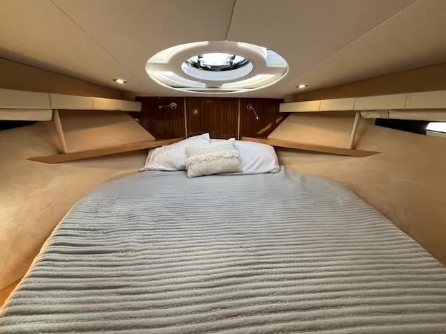 Slide: The Image of Luxurious 2009 Four Winns V435 yacht cabin with cozy bed and modern lighting. - 46