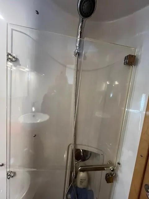 Slide: The Image of 2009 Four Winns V435 yacht shower with glass door and modern fixtures. - 49