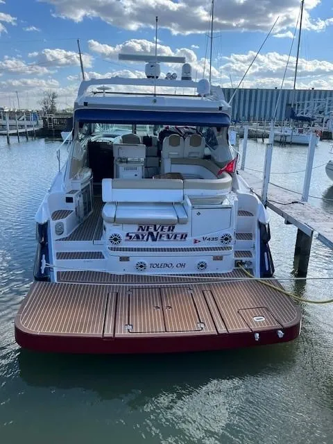 Slide: The Image of 2009 Four Winns V435 yacht docked at marina under blue sky. - 6