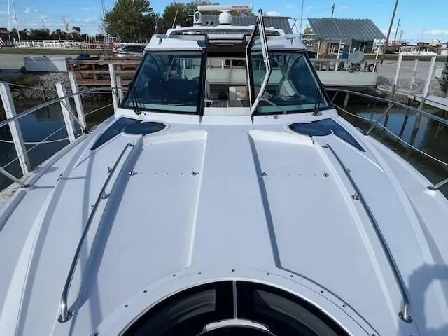 Slide: The Image of 2009 Four Winns V435 yacht docked at marina, front deck view. - 8